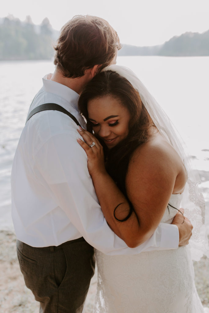 Julie and Josh slow dancing by the lake in woods of Crestline. Cristeal Felien Photography - Southern California Wedding Photographer