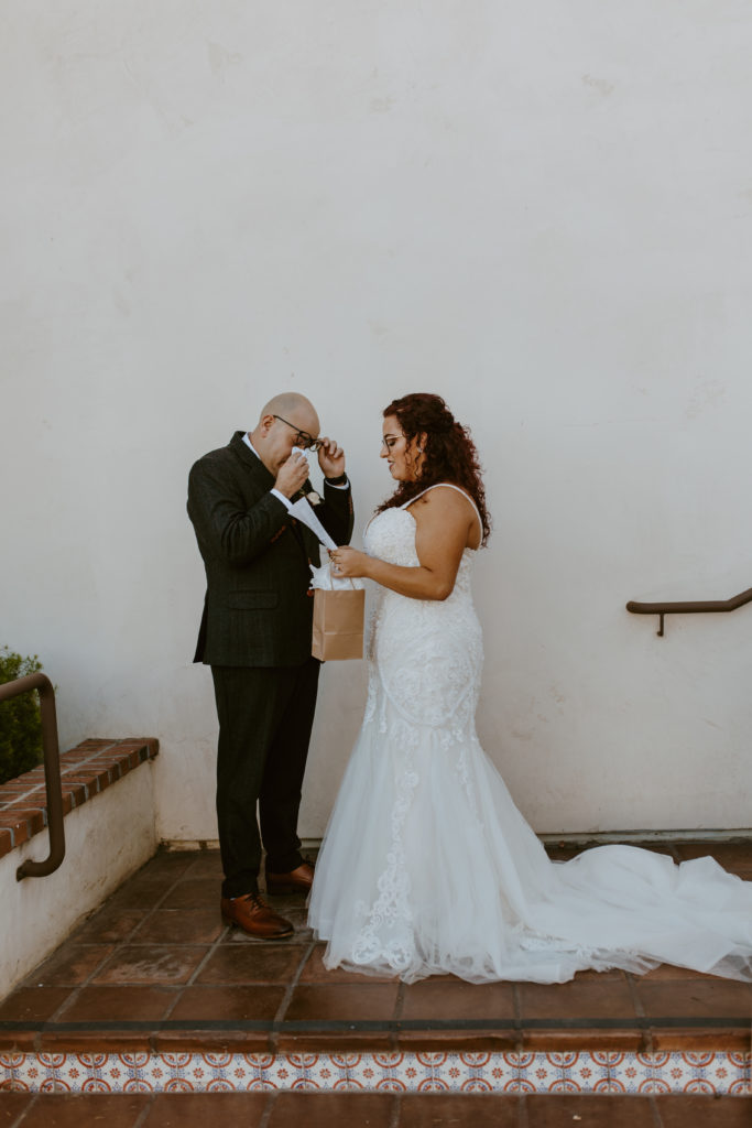 A couple has an emotional moment during their first look on their wedding day at Ponte Winery in Temecula California