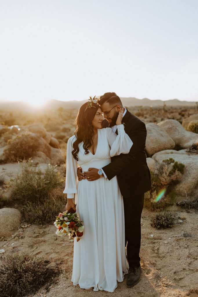 Newly married couple posing during photo session with Temecula wedding photographer
