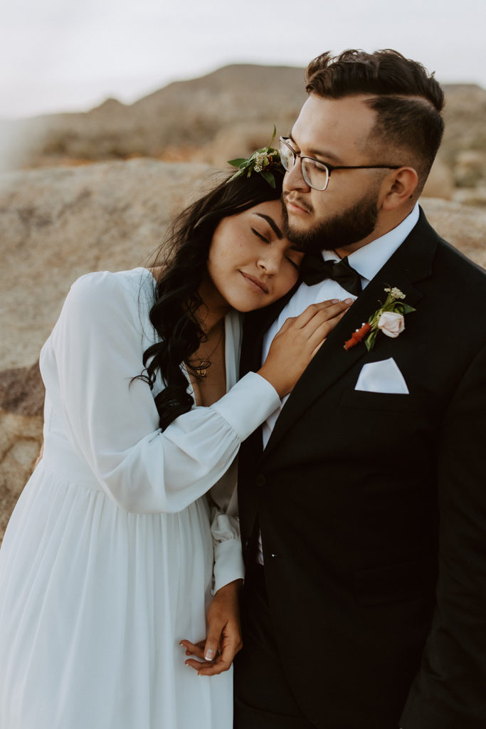 Newly married couple posing during photo session with Temecula wedding photographer