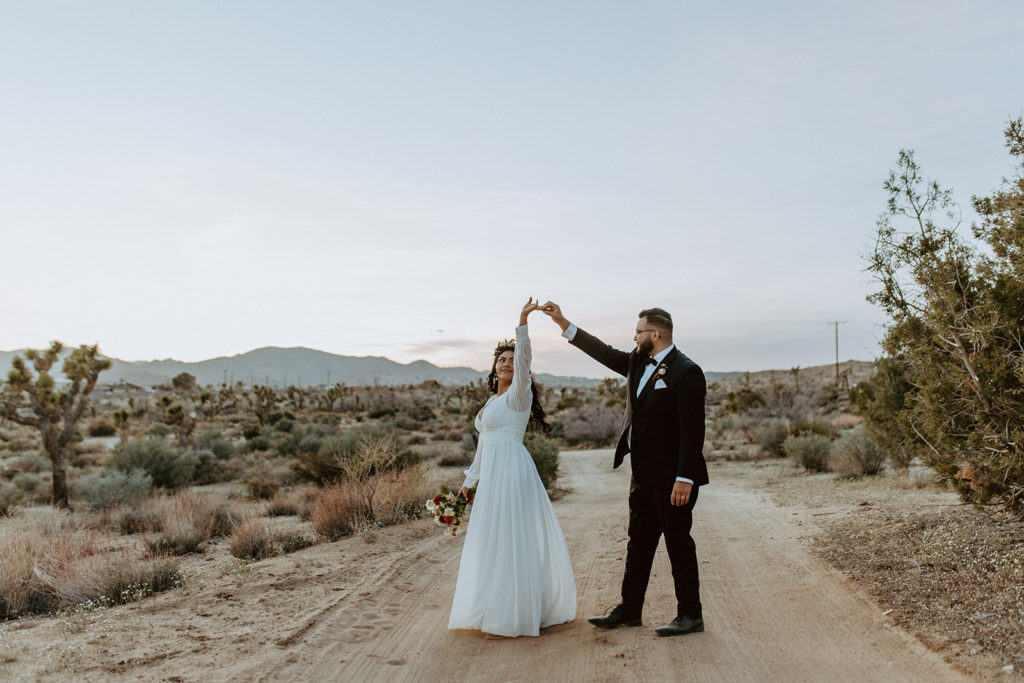 Newly married couple posing during photo session with Temecula wedding photographer